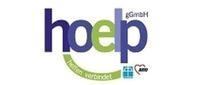 Der Nameszug das h und das p sind verbunden mit einem geschwungenen Unterstrich, auf dem "helfen verbindet" steht. Am Ende sind zwei kleine Logos der Diakonie und der Arbeiterwohlfahrt, die gemeinsam Gesellschaften der GmbH sind. 